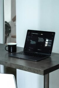 person working on laptop in a coffee shop making money online